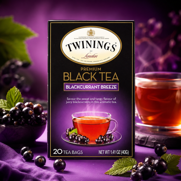 Twinings Premium Black Tea packaging with blackcurrants on a purple background