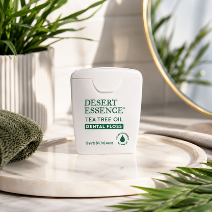 Desert Essence Tea Tree Oil Dental Floss - 50 Yards - Naturally Waxed w/ Beeswax - Thick Flossing No Shred Tape - On The Go - Removes Food Debris Buildup - Cruelty-Free Antiseptic