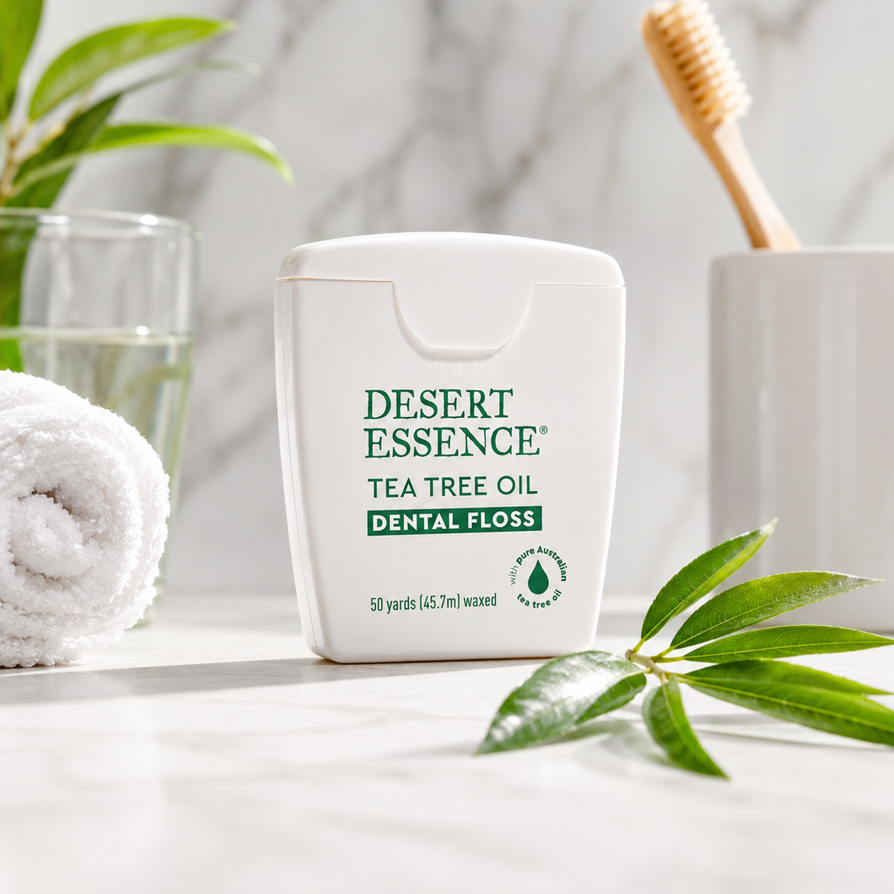Desert Essence Tea Tree Oil Dental Floss - 50 Yards - Naturally Waxed w/ Beeswax - Thick Flossing No Shred Tape - On The Go - Removes Food Debris Buildup - Cruelty-Free Antiseptic